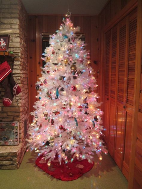 White iridescent tree pre-lit with multicolor lights. (I want one of these). White Christmas Tree Multicolor Lights, White Christmas Tree Colored Lights, Christmas Tree Multicolor Lights, Christmas Tree Colored Lights, Christmas Tree With Coloured Lights, Christmas Tree Multicolor, White Christmas Tree Lights, Colored Christmas Lights, Enchanted Christmas