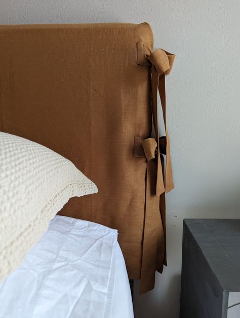 Transform your bedroom with this linen headboard. It comes in multiple sizes and colors. It is really easy to install, simply open it over the headboard, fold the sides and tie the bows. Because this is an open panel, it will adjust to any depth.  *Drop is 25 inches. Tie On Headboard Cushion, Slipcover For Headboard, Squiggle Headboard, Scandi Headboard, Headboard Cover Slipcovers, Reupholstered Headboard, Fabric Headboard Ideas, Hand Painted Headboard, Fabric Headboard Bedroom