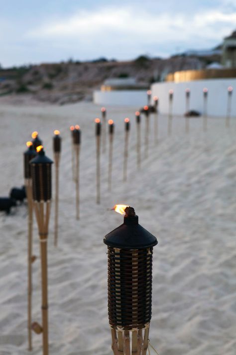 tiki torches for beach bbq Beach Bbq Party, Diy Wedding Benches, Tiki Aesthetic, St Lucia Beach, Fantasy Country, Beach Setting, Starting A Restaurant, Bali Garden, Sunset Beach Weddings