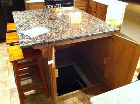 Hide the entrance to a secret fallout shelter, wine cellar, or basement in your kitchen island. | 43 Insanely Cool Remodeling Ideas For Your Home Gömda Rum, Skjulte Rum, Secret Passage, Panic Rooms, Storm Shelter, Secret Room, Diy Home Security, Hidden Rooms, Safe Room