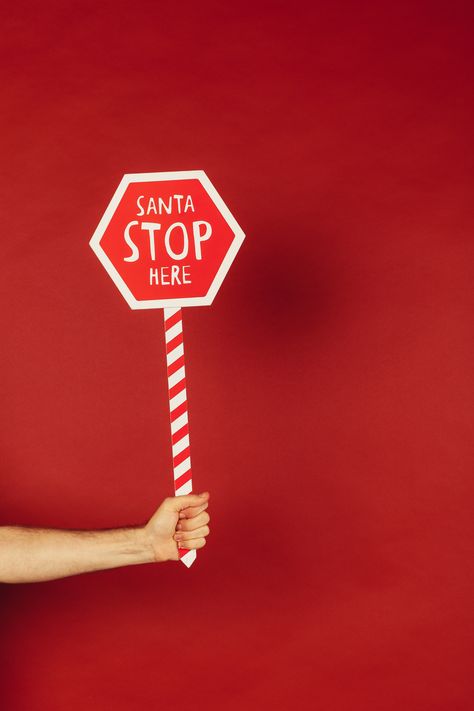 Person Holding Red and White Santa Stop Here Sign Â· Free Stock Photo, #White, #Santa, #Holding, #Person, #Red Christmas Backrounds, Santa Stop Here Sign, Airbrush App, Stop Sign, Hand Holding, Diy Signs, Christmas Theme, Red Background, Christmas Themes