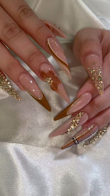 Karina Rodriguez on Instagram: "I’m in love with Crystals from @karina_rhinestonez  #fresnonails #559nails #nailart #lasrodrigueznaillounge #naildesign #blingnails #nailaddict #nailporn #longnails #nails #nails #nailpolish #nailswag #uñas #uñasacrilicas #fallnails" Bling Stiletto Nails, Golden Nails Designs, Egyptian Nails, Nails Aesthetics, Gold Stiletto Nails, White Nails With Gold, Oval Nails Designs, Acrylic Nails Stiletto, Trending Nails