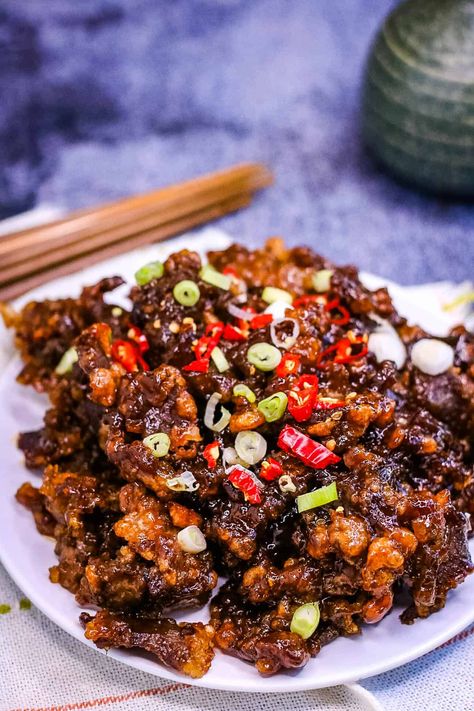 Crispy Chilli Beef is one of my favorite Chinese restaurant dishes—strips of tender beef are fried until crispy and then tossed in a sticky, sweet, spicy sauce. It’s easy to make at home, and no deep fryer is needed! Thai Food At Home, Crispy Beef Chinese, Chili Beef Recipe, Crispy Chili Beef, Chilli Beef Recipe, Sweet Spicy Sauce, Crispy Chilli Beef, Asian Cuisine Recipes, Chili Beef