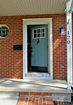 Adding trim around your door is a front door idea that gives your entryway true curb appeal, making it stand out more from the rest of the house. House Front Door Colors, Brick House Front Door, Brick House Front Door Colors, White Front Door, Brick House Exterior, Front Door Trim, Front Door Hardware, Black Front Door, Front Door Color