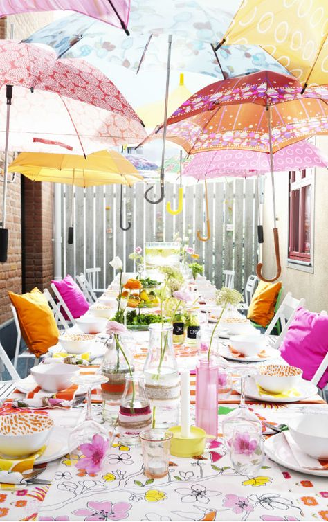 Create a fun canopy of umbrellas and mix and match fabric and serving ware in bright, fun colors for an outdoor party that’s sure to welcome the season. Wedding Shower Brunch Decorations, Wedding Shower Brunch, Cozy Wedding, Brunch Decor, Tafel Decor, בר מצווה, Spring Party, April Showers, Garden Cottage