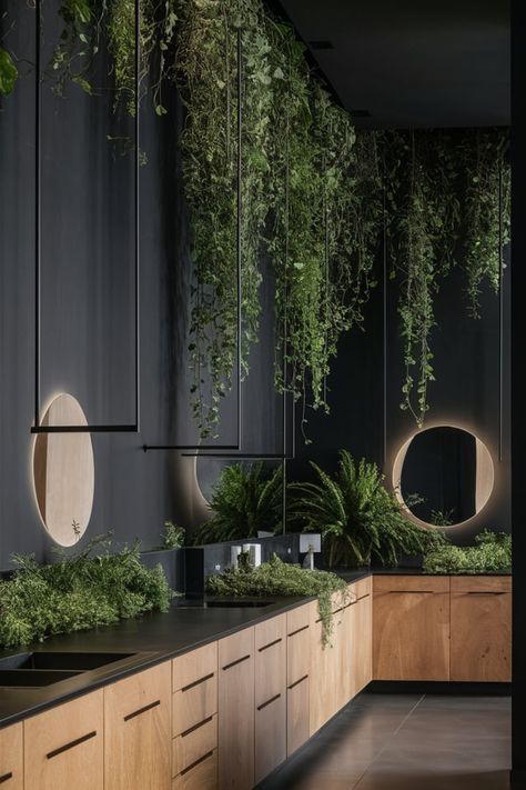 Design a modern bathroom sanctuary with dark, sleek walls, cascading plants, and wooden cabinetry. Subtle circular mirrors add softness to the bold, nature-inspired aesthetic. #ModernBathroomDesign #DarkWalls #GreenBathroomDecor #NaturalElements #BathroomInspiration #MinimalistBathroom #WoodenAccents #BathroomAesthetics #ContemporaryStyle #BathroomGoals Dark Green And Black Bathroom, Black And Wood Interior Design, Black And Wood Interior, Cascading Plants, Circular Mirrors, Green Bathroom Decor, Bathroom Sanctuary, Dark Beach, Green Accent Walls