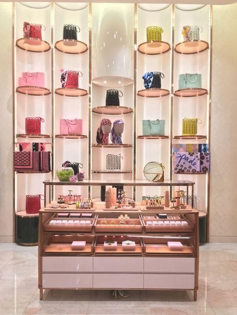 I thought this was an interesting wall fixture to sell bags and head scarves with the gondola infront of the display. source: Kate Spade Kate Spade Store, New York Office, Office Photo, Hudson Yards, Store Interiors, Head Scarves, Interior Display, Bag Display, Store Design Interior