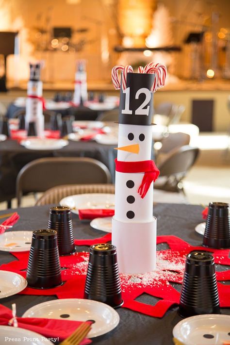 SNOWMAN TABLESCAPE Centerpieces Ideas - Have a super cool DIY Christmas this year with this table full of snowmen. Easy and simple to make snowman theme with can and household items.Craft your own fun decorations. Add a black tablecloth for a striking look. Red and white. by Press Print Party! #christmasdecor #christmas #christmastable #christmasdecorations #christmastablescapes #christmastabledecorations #snowman #snowmancrafts #tablesettings #tablescapes #christmascraft #christmascenterpieces Snowman Tablescape, Christmas Party Centerpieces, Christmas Party Table Decorations, Diy Snowman Decorations, Snowman Theme, Holidays Decorations, Black Party Decorations, Ward Christmas Party, Diy Christmas Table