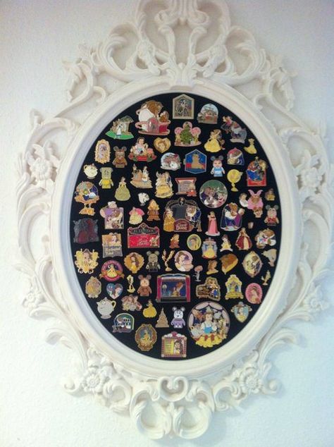 This is exactly what I want! A pretty cork board to display all of my Beauty and the Beast pins. If only I had this many...these are amazing! Thrifted Mirror, Disney Pin Display, Casa Disney, Haunted Mansion Wallpaper, Deco Disney, Disney College, Disney Rooms, Disney Home Decor, Disney Decor