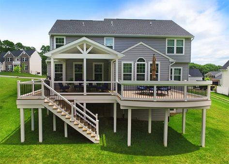 This custom deck & porch combo was designed and built to create more usable living space for the homeowner. Pull up a chair at the custom curved bar top or Porch Kits, Raised Patio, Building A Porch, Patio Deck Designs, Deck Construction, Deck Designs Backyard, Covered Deck, Deck Stairs, Deck Designs