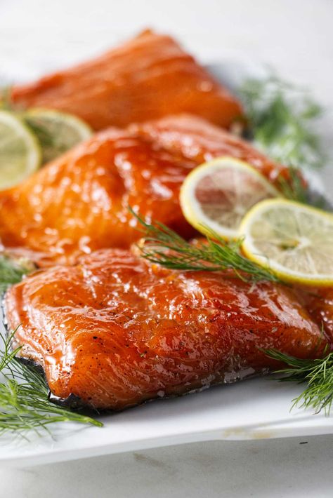 This Traeger smoked salmon recipe creates a flavorful, smoky and moist salmon made with a dry brine and a sweet soy glaze. Salmon Brine For Smoker, Salmon Maple Syrup, Salmon Brine, Traeger Ideas, Traeger Smoked Salmon, Smoked Salmon Brine, Recipes For Salmon, Traeger Smoker Recipes, Moist Salmon