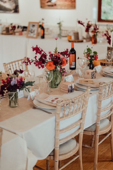 Small wedding at Langford Lakes — Emily & Steve Husband & Wife Wedding Photographers Red And Orange Wedding, Orange Wedding Decorations, Table Flower Arrangements, Orange Wedding Flowers, Colored Glass Vases, Carnival Wedding, Wedding Table Names, Floral Embroidery Dress, White Tablecloth