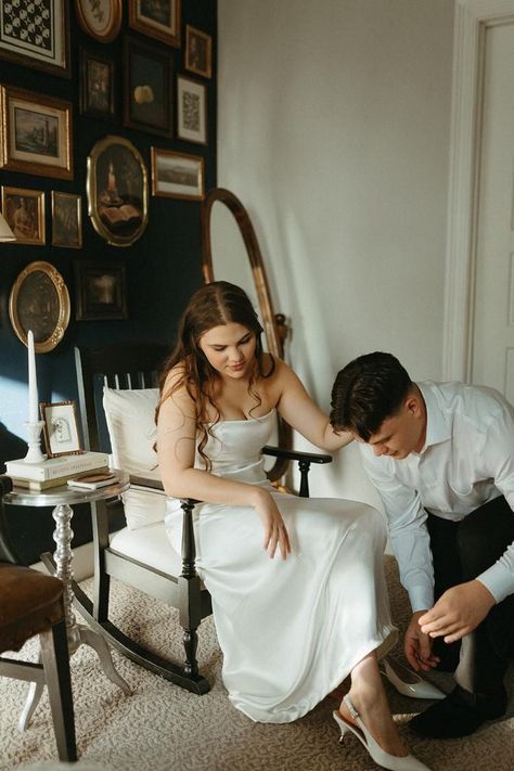 Groom helping bride with shoes on wedding day. Groom Helping Bride Get Ready, Bride And Groom Get Ready Together, Getting Ready Together Bride And Groom, Bride And Groom Getting Ready Together, Courthouse Photos, Bride And Groom Getting Ready, Getting Ready Together, Small Backyard Wedding, Laid Back Wedding