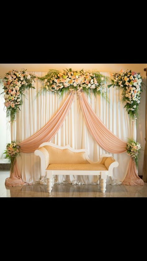 Simple Bridal Stage Decoration, Peach Stage Decoration, Engagement Decoration Simple At Home, Engagement Decorations Indian Simple Outdoor, Engagement Background Decoration At Home, Small Stage Decoration For Engagement, Small Stage Decoration For Wedding, Engagement Backdrop Ideas At Home, Simple Stage Decorations At Home