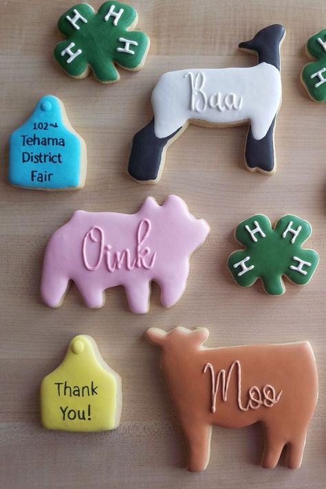 overhead view of multiple cookies in animal shapes; one sheep, one pig, and one steer designed sugar cookies Lamb Sugar Cookies Decorated, County Fair Gift Baskets, Pig Cookies Royal Icing, 4-h Cookies Decorated, 4-h Display, 4h Cookies Decorated, Sheep Sugar Cookies Decorated, 4h Themes Ideas, 4 H Food Project Ideas