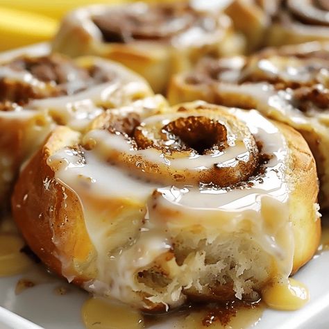 Banana Bread Cinnamon Rolls combine soft banana bread with gooey cinnamon filling. Perfect for brunch or dessert! Try them today! Recipe For Cinnamon Rolls Easy, Banana Baking Ideas, Easy Family Dessert Ideas, Banana Pastries, Baking With Bananas, Banana Biscuits, Soft Banana Bread, Banana Cinnamon Rolls, Banana Bread Cinnamon Rolls