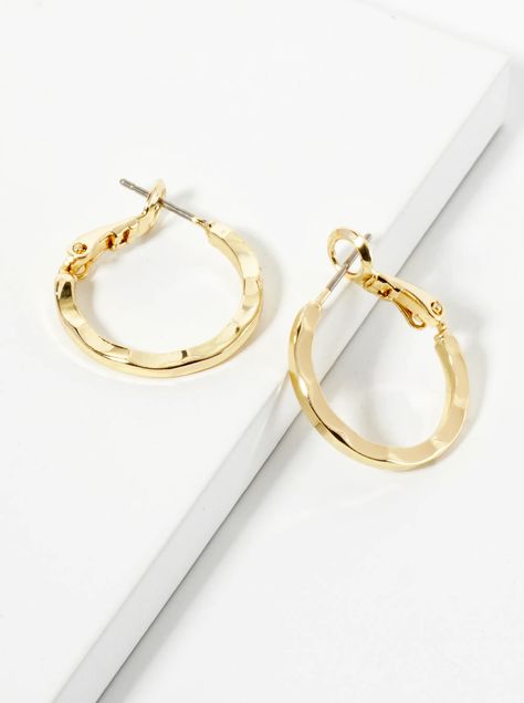 These 20mm hammered latch-back hoop earrings feature a distinctive textured design, where the polished metal is carefully hammered to create a beautiful, subtle ripple effect. The result is a sophisticated, light-catching finish that adds dimension and depth to the classic hoop shape. The secure latch-back closure ensures a comfortable and reliable fit, making these earrings both stylish and practical. Perfect for everyday wear, they combine modern elegance with a touch of artistic flair. Ripple Effect, Textured Design, Modern Elegance, Everyday Wear, Hoop Earrings, How To Wear, Design