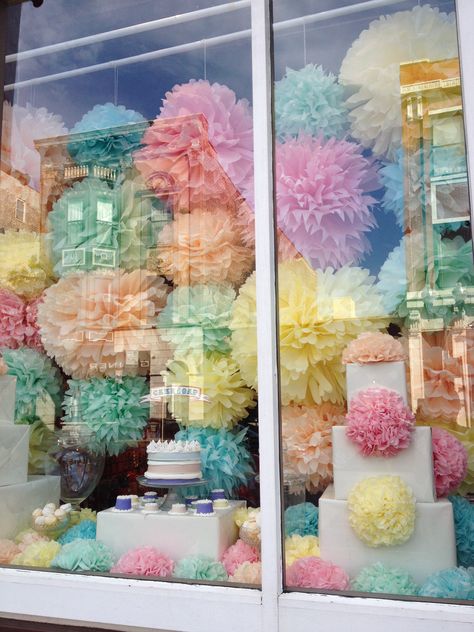 pom-pom window display // chicago                                                                                                                                                     More Window Display Background, Birthday Window Display, Art Gallery Window Display Ideas, Grand Opening Window Display, Sweet Window Display, Easter Shop Window Displays, Pastel Window Display, Bakery Window Display, Anthro Window Display