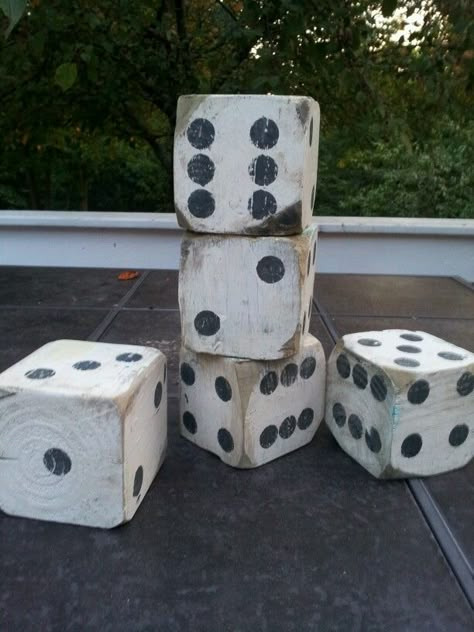 Free wood from my brothers deck+inspiration from Pinterest= Lawn dice . We love them.  They are both decorative and functional! I used 4x4 post cut to 3 1/2" , left over paints and a sander to distress them a little. 4x4 Posts Ideas, 4x4 Wood Projects, 4x4 Crafts, 4x4 Wood Crafts, Wood Dice, Scrap Wood Crafts, Wood Block Crafts, Wood Scraps, Block Craft