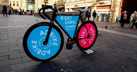 Ads On Bikes: The New & Trendy Marketing Strategy - Unlimited Graphic Design Service Outdoor Marketing, Ride Bicycle, Social Design, Burning Questions, Advertising Services, Bike Parking, Bicycle Frame, Outdoor Banners, Local Business