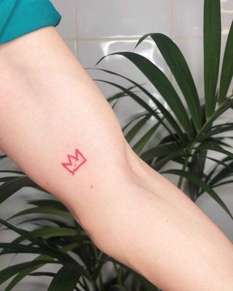 Red little crown tattoo by Loz Thomas inked on the left arm Red Crown Tattoo, Little Crown Tattoo, Simple Crown Tattoo, Basquiat Tattoo, Basquiat Crown, Small Crown Tattoo, Small Symbol Tattoos, Stick Tattoo, Red Dragon Tattoo