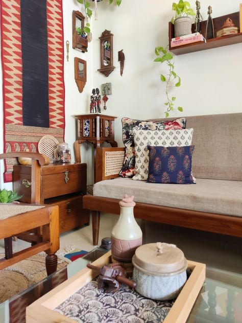 Eclectic, maximalist, earthy living room filled with Indian handcrafted art , artefacts and accents. Small cozy apartment with teakwood furniture. Living Room Inspo Indian, Indian Aesthetic Furniture, Asthetic Indian Room Decor, Small Indian Living Room, Vintage Indian Home Aesthetic, Vintage Desi Aesthetic House, Indian Living Room Decor, Cozy Eclectic Living Room, Living Room Indian