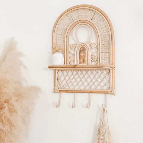 We realized this beauty hasn’t been getting enough love on our feed! 🌿✨ The Paloma Rattan Wall Shelf with hooks, intricately designed to bring a touch of elegance to any room, is available online now. Elevate your decor game! 💛 #HomeDecor #RattanLove #BohoDecor #InteriorDesign #HomeInspiration #DecorGoals #BohemianStyle #HandmadeDecor #RattanFurniture #NaturalLiving #EcoFriendlyDecor #SustainableLiving #BohoVibes #InteriorGoals #HomeStyling #BohoChic #RattanShelves #DecorInspo #HomeDecorIdea... Mirror Wall Design, Rattan Wall Shelf, Apartment Finds, Mirror Decor Ideas, Wall Shelf With Hooks, Displaying Photos, Shelf With Hooks, Rattan Wall, Designed Wall