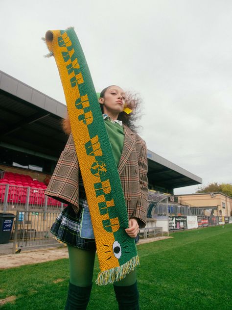 Adapt launches Protest Gear, a football scarf-inspired collection emblazoned with activist slogans Oversize Denim Jacket, Baggy Jean Shorts, Scarf Photography, Graphic Scarf, Calls To Action, Football Scarf, Adidas Sambas, Baggy Jean, Simple Wardrobe