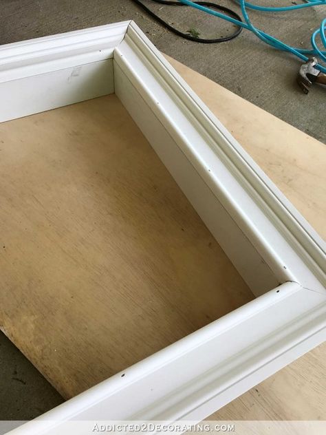 how to build an easy DIY frame for a wall mounted flat screen tv - 4 - glue and nail the frame to the box Easy Diy Frame, Cornice Tv, Deco Tv, Television Wall, Swivel Tv Stand, Swivel Tv, Tv Covers, Tv Wand, Mdf Panel