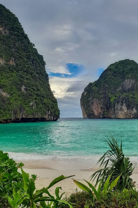 a white sand beach surrounded by mountains at Maya Bay Thailand Kho Phi Phi Thailand, Ko Phi Phi Thailand, Koh Phi Phi Thailand, South Thailand, Phi Phi Thailand, Thailand Destinations, Beautiful Beaches Paradise, Sky Resort, Thailand Beach