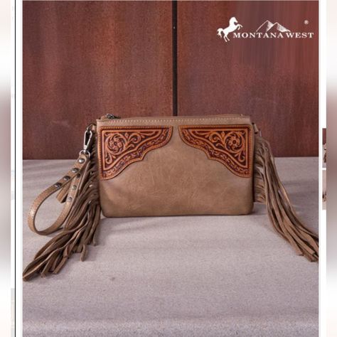 Introducing The Montana West Floral Tooled Fringe Wristlet Clutch/Crossbody Bag - Your New Go-To Accessory For Any Occasion! This Stylish Bag Measures 9.5 X 0.25" X 6.25" And Features Beautiful Floral Tooling And Trendy Fringe Details That Will Make You Stand Out From The Crowd. The Top Zipper Closure Ensures All Your Belongings Stay Secure, While The Inside Clutch Offers A Zippered Pocket And 3 Credit Card Slots For Organization On-The-Go. Need Some Extra Storage? There's An Additional Zipper P Trendy Fringe, Skull Wallet, Rodeo Fashion, Handbag Patterns, Floral Elements, Wristlet Clutch, Decorative Design, Black Leather Handbags, Crossbody Clutch