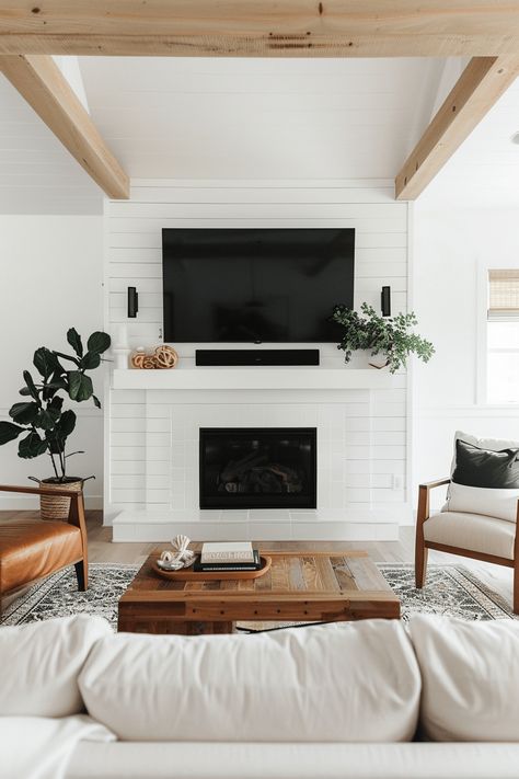 living room painted white and tv mounted above fireplace Salons Cottage, White Brick Fireplace, Small Basements, Cottage Living Rooms, Remodeling Mobile Homes, Basement Bedrooms, Living Room Remodel, Basement Design, Cottage Living