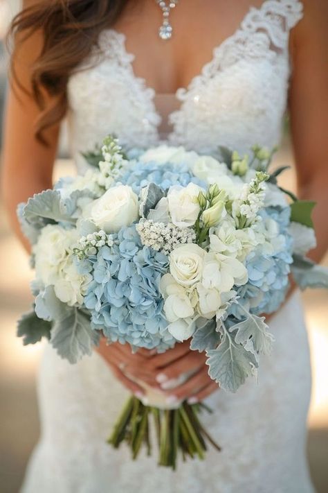 Looking for floral inspiration for your wedding? Hydrangeas bouquets with white, blue, pink, and green flowers offer endless possibilities. These ideas cater to any style, from rustic to elegant, providing a versatile and stunning option for your wedding flowers. Embrace the lush beauty of hydrangeas to add a refreshing and vibrant element to your wedding decor. Bouquet With Blue Hydrangea, Rustic Blue And White Wedding, Wedding Theme Blue And White, White And Blue Hoco Bouquet, Hydrangea And Carnation Bouquet, White Roses And Blue Hydrangeas, Blue White Green Wedding Flowers, Light Blue Hydrangea Bouquet, Lily And Hydrangea Bouquet