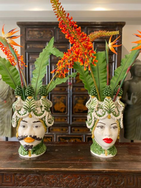 This 48cm Traditional Sicilian Ceramic Moro Head Vase showcases the intricate craftsmanship and vibrant colours of Sicilian pottery. Made with traditional methods, it features a beautiful green Pinecone design that adds a touch of Sicilian charm to any home decor. Bring a piece of Sicilian culture into your home with this hand-painted vase. H.48 L.28 Handcrafted Sicily Home Decor, Modern Sicilian Interior, Sicilian Bathroom Decor, Sicilian Home Decor, Sicilian Interior, Sicilian Decor, Sicilian Pottery, Sicilian Head Vase, Caltagirone Sicily