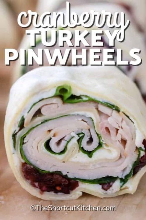 Delicious cranberry turkey pinwheels are anything but boring! It is so easy to roll up the flavor with these simple turkey roll ups. Cranberries, cream cheese, mayo, turkey breast, and spinach are the winning combination for this appetizer or even lunch option. Add a little more zing by including some bacon, ranch dressing, or extra cheese. #turkeypinwheels #turkeyrollups #turkeypinwheelsrecipe #theshortcutkitchen