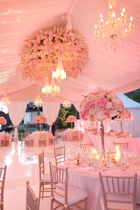 Pink tent wedding with flower chandelier. #PinkWedding Photography: Samuel Lippke for Ira Lippke Studios. Read More: https://www.insideweddings.com/news/planning-design/pretty-in-pink-wedding-decor-that-every-bride-will-love/2047/ Elegant Pink Wedding Decorations, Quinceañera Red Roses Theme, Pink Flowers Quince Theme, Pink Roses Quinceanera Theme, Quince Table, 15 Party Ideas Quinceanera, Pink Flower Wedding, Wedding Tops, Quince Planning