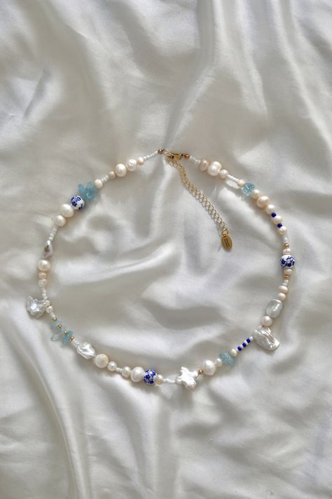 this necklace is inspired by the dreamy and exciting island of Mykonos; where the azure Aegean Sea meets white-washed architecture. each element is thoughtfully chosen to capture the essence of Mykonos--the blue and white color palette, keshi pearls to mirror the island's natural beauty and architectural uniqueness, and aquamarine gemstone chips infuse the design with a sense of tranquility and serenity. handmade with:  baroque, keshi and freshwater pearls 14k gold filled beads aquamarine gemsto Sea Jewelry, Gemstone Necklaces, Aegean Sea, Keshi Pearls, Aquamarine Gemstone, Pearl Gemstone, Blue Necklace, Bead Jewellery, Czech Beads