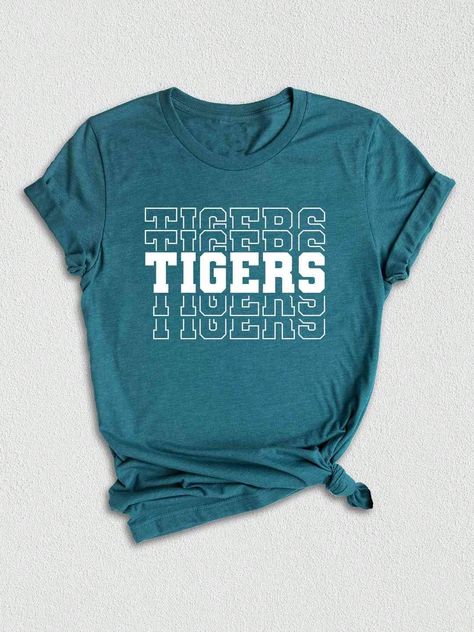 Introducing our Tigers Mascot Shirt, the perfect apparel for all the Tiger fans out there!  Whether you're a proud member of the Tigers team, a dedicated fan, or simply want to show your support, this shirt is a must-have addition to your collection. Designed with the iconic Tigers Mascot, this shirt captures the spirit and energy of your beloved team. Made with high-quality materials, this Tigers School Shirt is not only comfortable but durable as well. You'll love the softness of the fabric against your skin, making it ideal for everyday wear or game days.  In addition to being a stylish fashion statement, this Tigers Fan Shirt also makes for a great gift. Surprise your friends, family, or fellow Tigers enthusiasts with this unique and trendy graphic tee. Perfect for birthdays, holidays, High School Shirt Designs Spirit Wear, Elementary Spirit Wear, Cute School Spirit Shirts, School Spirit Wear Ideas, School Mascot Shirt Ideas, Elementary School Tshirt Designs, College Tshirt Designs, School Graphic Tees, Tshirt Design Ideas Trendy