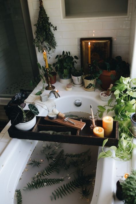 A dreamy bath surrounded by green plants. A wooden board crosses the tub filled with candles, more plants, a butterfly safety razor, and a shaving brush. The photo is moody, dark, and dreamy. Bath Aesthetic, Beeswax Pillar Candles, Spiritual Bath, Dream Bath, Boho Bathroom, Relaxing Bath, Dream Apartment, Dream Bathroom, Dream House Decor