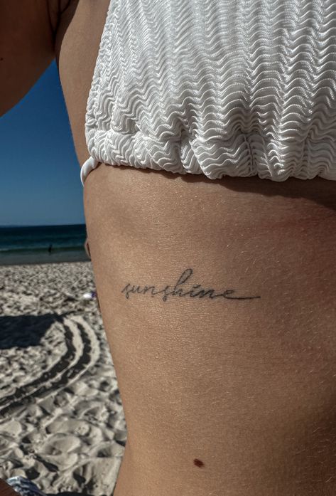 Word Sunshine Tattoo, Easy Does It Tattoo, Pocket Full Of Sunshine Tattoo, Tattoo Ideas Sunshine, Sunshine Cursive Tattoo, Sun Quotes Tattoo, Beach Quotes Tattoo, I Am The Sun Tattoo, You’re The Sun To Me Tattoo