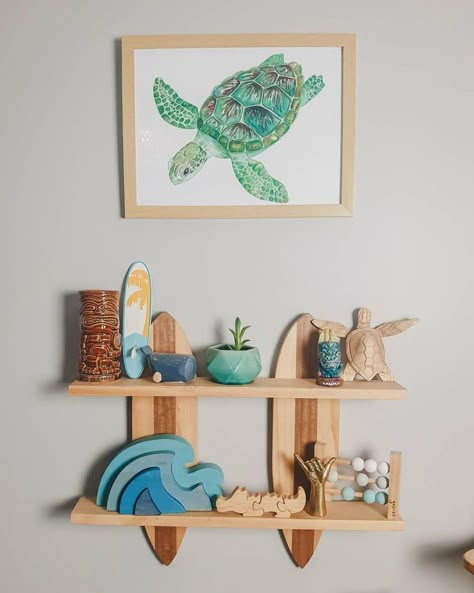 Ocean baby nursery decor with turtle painting, surf board and wooden waves Boy Beach Nursery, Ocean Nursery Ideas, Ocean Baby Nursery, Seaside Nursery, Boho Beach Nursery, Beach Baby Nursery, Melody Room, Ocean Baby Rooms, Surfer Nursery