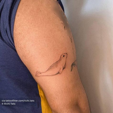 Micro-realistic seal tattoo on the tricep. Marine Animals Tattoo, Puffin Tattoo, Tricep Tattoo, Tricep Tattoos, Seal Tattoo, International Tattoo, Duck Tattoos, Shark Tattoo, Shark Tattoos