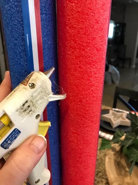 Last year I made some wooden firecrackers for July 4th, and this year I wanted to make something a bit different. I was at the Dollar Store and saw some pool noodles and came up with this idea. #diy #fourth of july #july #america #patriotic #diy decor Diy 4th Of July Decorations, Easy Crafts For Adults, Decor For Events, Diy Dishwasher Tablets, Wooden Firecrackers, Diy Floral Wreath, Patriotic Diy, Farmhouse Style Wreath, Craft Projects For Adults