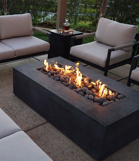 7 Reasons Why a Fire Pit is the Perfect Addition to Your Summer Evenings(and Other Occasions too) 🌃🔥Article out now | #starfire #starfiredirect #gasfirepits #outdoorliving #patiodesign #landscapingdesign #QualityMaterials #backyarddesign #backyardinspo #outdoorlivinginspo #summervibes #summer #summernights #outdoorspaces #summerentertainment Rectangular Fire Pit Ideas, Gas Fire Pit Ideas Backyard, Fire Pit Balcony, Square Fire Pit Ideas, Modern Outdoor Fire Pit, Black Fire Pit, Garden Ideas Patio, Modern Outdoor Firepit, Luxury Fire Pit