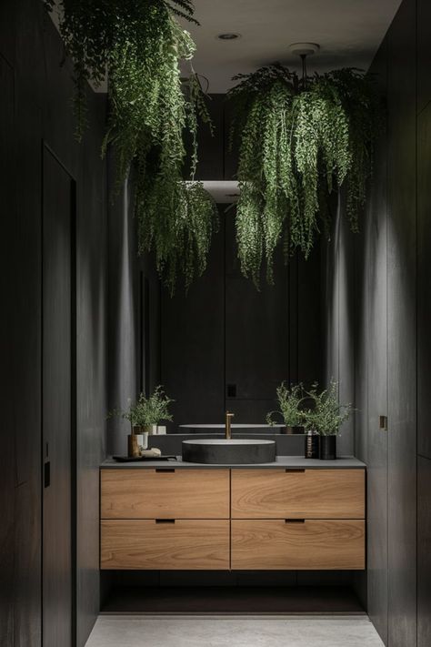 Create a serene bathroom by merging sleek dark walls and minimalist fixtures with cascading greenery. Add natural wood cabinetry and circular mirrors for a contemporary yet balanced design. #ModernBathroomDesign #DarkWalls #GreenBathroomDecor #NaturalElements #BathroomInspiration #MinimalistBathroom #WoodenAccents #BathroomAesthetics #ContemporaryStyle #BathroomGoals Circular Mirrors, Green Bathroom Decor, Serene Bathroom, Balanced Design, Bathroom Themes, Circular Mirror, Bathroom Goals, Dark Walls, Home Libraries