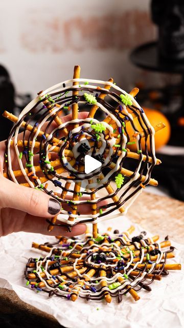 Sophia Assunta | Cute Treats and Party Recipes on Instagram: "These  viral pretzel spiderwebs are super easy to make! All you need is pretzel sticks, melted chocolate, and Halloween sprinkles!  They’re a super cute way to celebrate the spooky season 👻

You can find the full tutorial on my website, or comment ‘tutorial’ for the link sent to your DMs.

Happy snacking, and be sure to follow for 31 days of Halloween, with a new fun spooky treat every day of October 😱🎃

#halloween #halloweentreats #pretzels #halloweenpartyfood #halloweendessert #chocolatecoveredpretzels #spiderwebpretzels" Pretzel Spiderwebs, Halloween Sprinkles, Pretzel Sticks, Spooky Treats, October Halloween, 31 Days Of Halloween, Melted Chocolate, Party Recipes, Chocolate Covered Pretzels