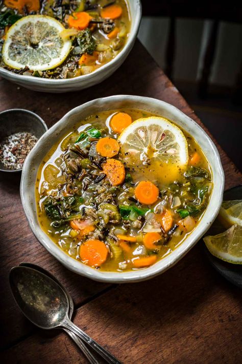 This vegan wild rice soup is packed with vegetables, herbs and bright lemon juice for a super easy and flavorful soup. Thanks to the richness of wild rice, this is the perfect soup to enjoy on a cold winter or fall evening. It's also great for meal prep and can be customized with your favorite protein for a well-rounded meal. Vegan Wild Rice Soup, Vegan Wild Rice, French Lentil Soup, Rice Lemon, Kale Vegetable, Gf Soups, Soup With Vegetables, Lemon Rice Soup, Soup Dishes