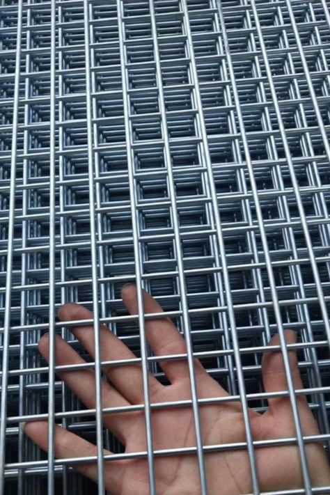 Welded Wire Mesh can be divided into welded mesh rolls and welded wire mesh panels. The welded wire mesh rolls are widely used for garden fencing, plaster mesh. Welded Wire Mesh panel has thicker wire diameter and larger opening sizes for high security applications, such as prison fencing, factory fencing and other site security fencing. Wire Mesh Fence Ideas, Mesh Fence Ideas, Wire Fence Ideas, Wire Fence Panels, Metal Mesh Screen, Security Fencing, Welded Wire Fence, Deck Remodel, Window Mesh