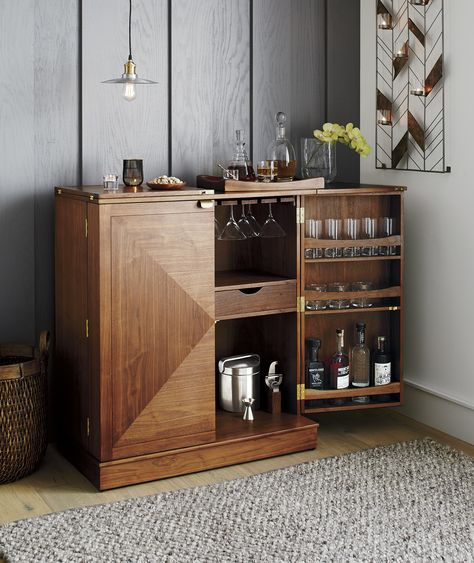 Parquet panels piece together gorgeous grain and color in this walnut bar cabinet that's ready to roll about the room for instant entertaining. With a flip and pull of the clean-styled brass hardware, the bar is open for business. Metal Wall Candle Holders, Home Bar Cabinet, Barrel Bar, Home Bar Design, Wine Bar Cabinet, Bar Storage, Wooden Cabinet, Wall Candle Holders, Gold Interior