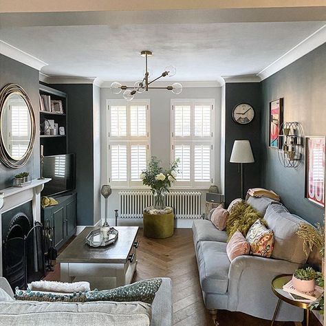 We adore this lounge with herringbone floor in an Edwardian home. The walls are dark which keeps the room snug looking. The period features have been restored including the fireplace and cornicing. In the home of @roseontherow on Instagram. Edwardian Living Room, Edwardian Home, Victorian House Interiors, Snug Room, Feature Wall Living Room, Victorian Living Room, Narrow Living Room, Dark Living Rooms, Park Street